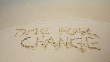 Time For Change Text In Sand Near The Sea