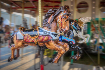 Fototapeta na wymiar A wooden carousel horse at the local county fair.