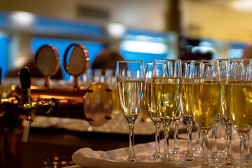 many beautiful glasses of champagne during a party on the table