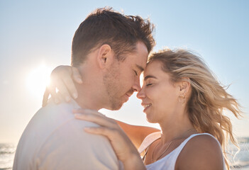 Obraz premium Hug, love and couple at the beach for peace, support and quality time during a holiday in Maldives. Relax, trust and man and woman on a travel vacation with affection on a date by the tropical water