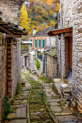 Fototapeta na wymiar The picturesque village of Dilofo during fall season with its architectural traditional old stone buildings located on Tymfi mount, Zagori, Epirus, Greece, Europe