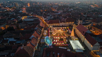 Landscape photography of Sibiu city center with the Christmas Fair, shot from a drone at sunset...