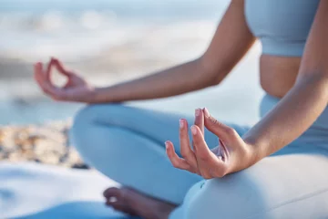 Fotobehang Yoga, meditation and zen hands of woman at beach for fitness, exercise and mindfulness in nature, outdoor wellness and peace. Meditate, spiritual and healing person hand sign or lotus pose by a sea © D Theron/peopleimages.com