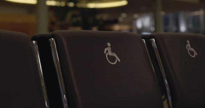 Handicap seats in airport gate - close up on sign
