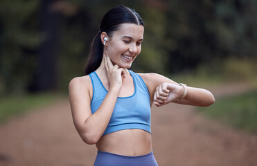 Fototapeta premium Fitness, runner and woman checking watch for pulse, time or heart rate after running exercise or workout in nature. Athletic female monitoring physical wellness or training performance on smart watch