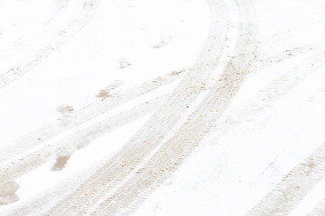 Traces of car tires on fresh snow. winter background