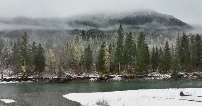 Winter Scene of Forests Mountain Snow on Stillaguamish River Granite Falls Washington USA