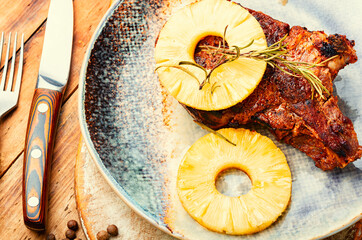 Prepared meat chop in pineapple sauce.