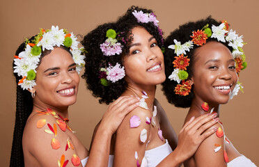 Beauty, skincare and flowers with black women and cosmetic portrait with floral creative design against studio background. Flower aesthetic, wellness and natural cosmetics with nature and self care.