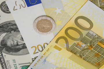 Banknotes of Euros and Dollar and one coin 
