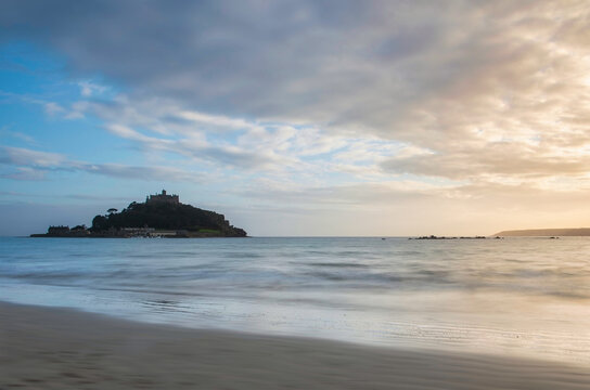Lovely landscape image of St Michael's Mount in Cornwall England during soft pastel color sunset evening