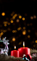 Two burning red candles on the New Year's table
