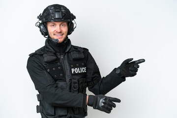 SWAT man over isolated white background pointing finger to the side and presenting a product