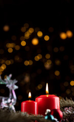 Two burning red candles on the New Year's table