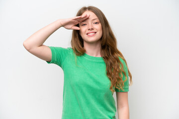 Fototapeta premium Young pretty woman isolated on white background saluting with hand with happy expression