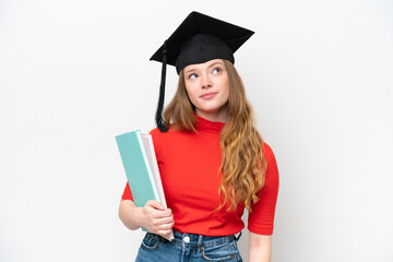 Young university graduate woman isolated on white background and looking up