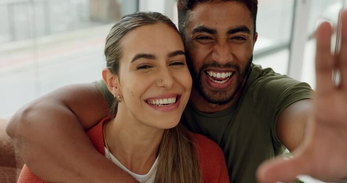 Couple, selfie and cheek kiss in house, home or hotel living room trust, interracial love or support. Portrait, happy smile and man or woman bonding in social media pov photography or profile picture