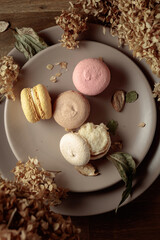 Delicious sweet colorful macaroons with dried flowers.