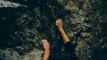 climber's hand while bouldering