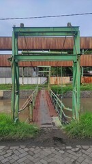 Fototapeta na wymiar An old rusty bridge on the downtown overpass the river
