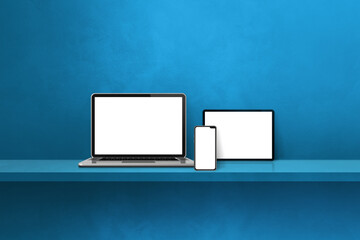 Laptop, mobile phone and digital tablet pc on blue wall shelf. Horizontal background