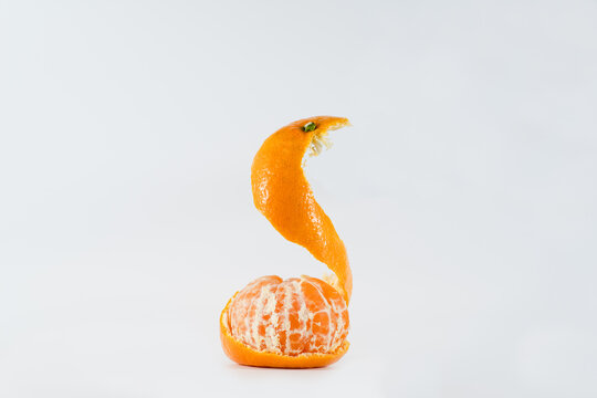 Bright Tangerine on a Clean Background. Tangerine Slices. Peeled Tangerine.  Citrus in Flight. Mandarin Peel Stock Image - Image of juicy, fruits:  207471359