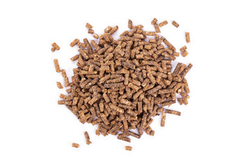 Animal feed. Sunflower granulated feed  on white background, close-up. Animal cattle food pellets. Heap of animal feed pellets  on white background.