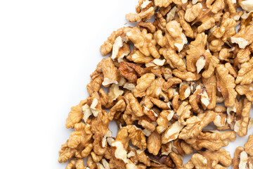 Closeup of big shelled walnuts pile. Nuts are a source of vegetable protein. Space for text.