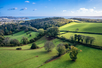 Fields and Farms over Cockington from a drone, Paignton, Torquay, Devon, England