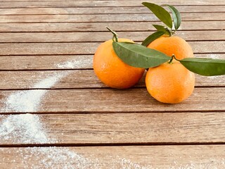 tangerines on wooden table. Copy space