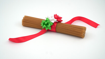 Spaghetti with red ribbon and colors of Italy's flag on an isolated background
