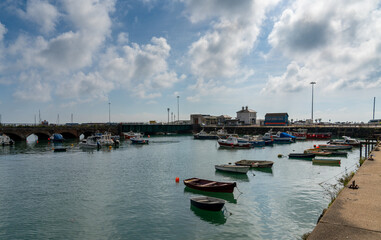 Fototapeta na wymiar view of the Folkestone Harbour with many boats at anchor