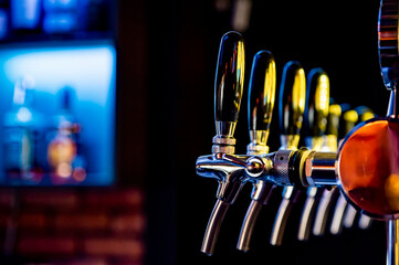 many beer taps in bar or pub