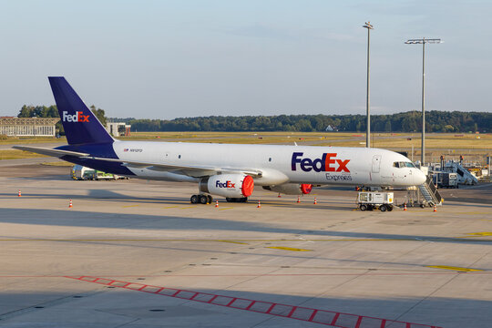 HANOVER, LOWER SAXONY, GERMANY - AUGUST 14, 2022: Federal Express Boeing 757 aircraft in Hannover Airport, Germany. FedEx Express American cargo airline.