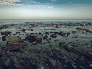 Stony coast of Cape Arkona promontory. Evening mood at sea.