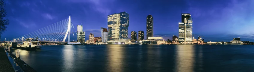 Zelfklevend Fotobehang Evening cityscape, panorama, banner - view of Rotterdam with Tower blocks in the Kop van Zuid neighbourhood and Erasmus Bridge, The Netherlands © rustamank