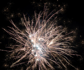 Bright explosion of fireworks on black sky
