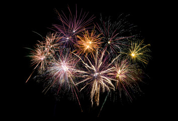 Colored fireworks on black background copy space