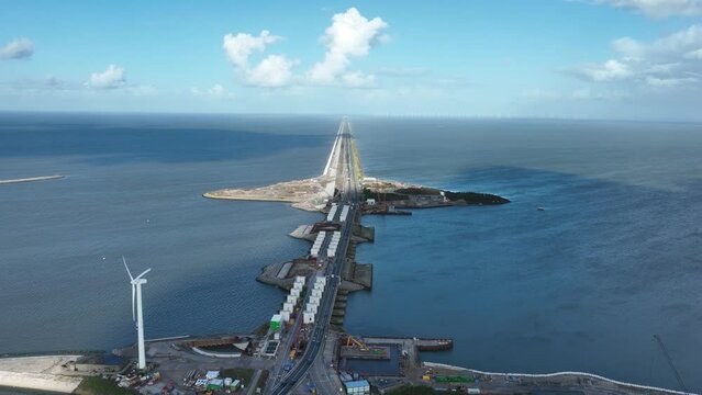 Afsluitdijk construction on pumping stations new sluices and the A7 near Den Oever, Kornwerderzand , and Zurich. Lock for shipping, road traffic cyclists and walkers. Aerial drone view.