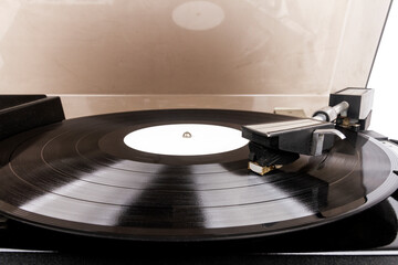 Close up of turntable needle on a vinyl