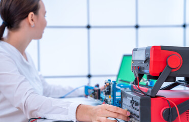 physical experiments in the University Laboratory of Quantum Optics a young woman student adjusts the measuring equipment