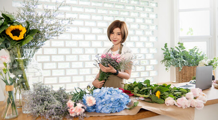 Startup successful sme small business entrepreneur owner asian woman standing table with flowers at florist shop service job. Portrait of caucasian girl successful owner environment friendly banner