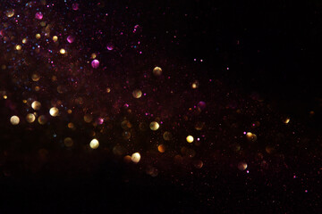 background of abstract glitter lights. gold and black. de focused - obrazy, fototapety, plakaty