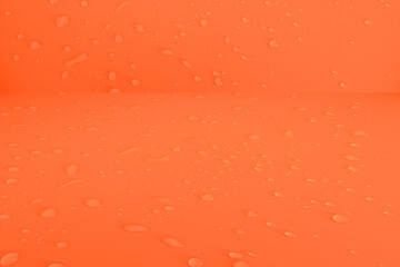 Defocus blurred water drops on orange background. waterdrops detail the background. Water splash, water spray background. Calm orange background with water drop.