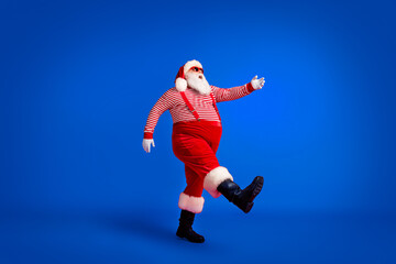 Full length profile photo of grandfather grey beard step raise hand wear santa claus x-mas costume...