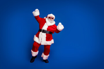 Full length body size view of attractive cheerful Santa dancing having fun rejoicing good mood isolated over bright red color background