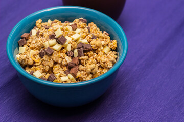Healthy homemade muesli in a blue bowl