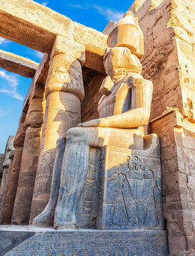 Statue of Seated Rameses II by the entrance of Luxor Temple, Egypt