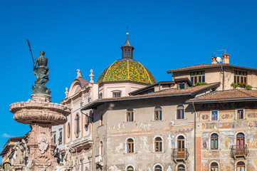 Trento city:view of  the Duomo square and the Neptune fountain with people. Trento is a capital of province Trentino Alto in northern Italy - november 18, 2022