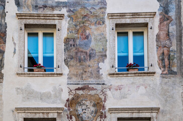 Trento city: the facade of the Palace Niccolini at the historic centre of Trento - Trentino Alto Adige - northern Italy, november 18, 2022